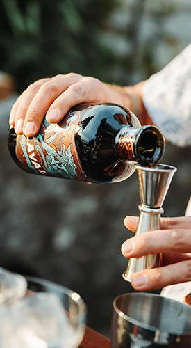 Pouring Laval Pelinkovac – the first step toward a perfect cocktail.
